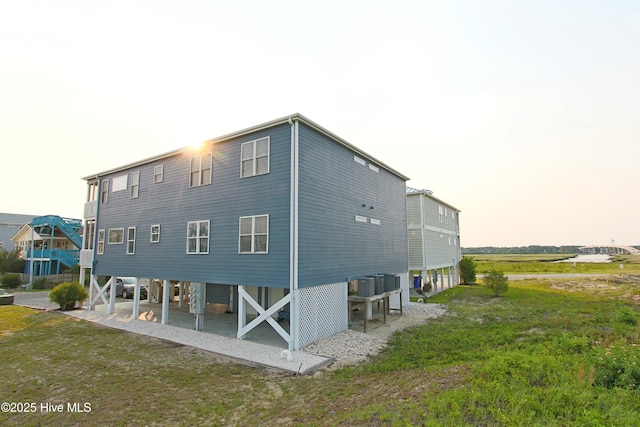 405 27th St Unit A, Sunset Beach, NC 28468 - rear view of property with cooling unit