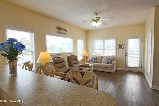 405 27th St Unit A, Sunset Beach, NC 28468 - dining room featuring ceiling fan, dark wood-style floors, baseboards, and a textured ceiling
