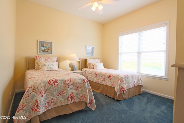 405 27th St Unit A, Sunset Beach, NC 28468 - bedroom featuring baseboards, carpet floors, and ceiling fan