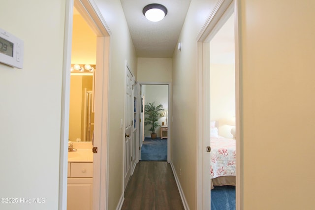 405 27th St Unit A, Sunset Beach, NC 28468 - hall featuring dark wood-style floors