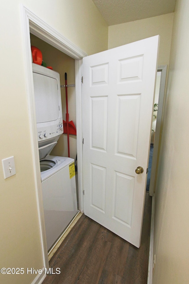 405 27th St Unit A, Sunset Beach, NC 28468 - laundry room featuring stacked washer and clothes dryer and dark wood-type flooring