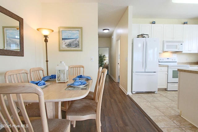 405 27th St Unit A, Sunset Beach, NC 28468 - dining space featuring baseboards