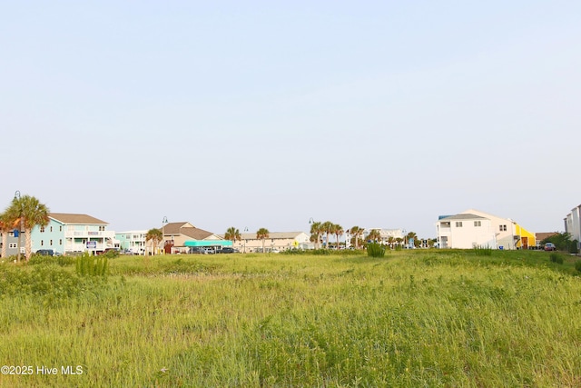 405 27th St Unit A, Sunset Beach, NC 28468 - view of yard featuring a residential view