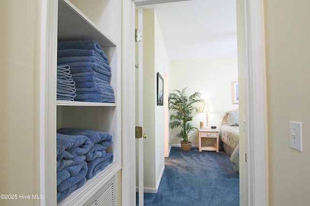 405 27th St Unit A, Sunset Beach, NC 28468 - hall with dark colored carpet and baseboards