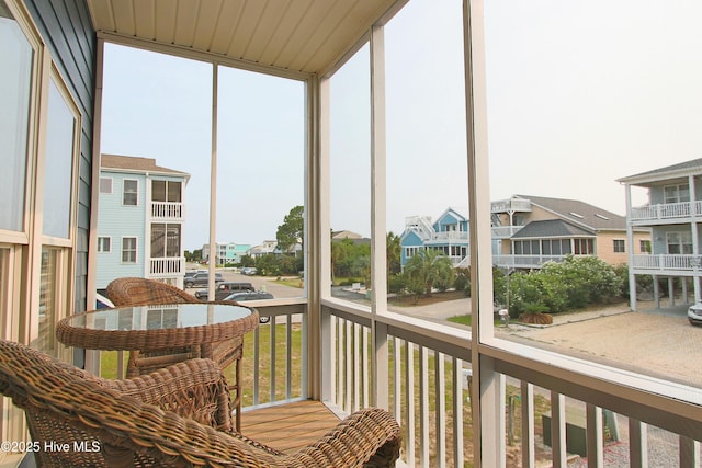 405 27th St Unit A, Sunset Beach, NC 28468 - sunroom / solarium with a residential view