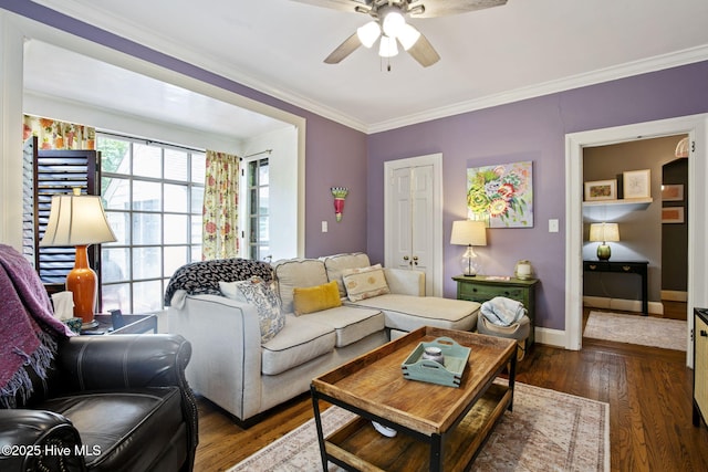 1305 Kenan St NW, Wilson, NC 27893 - living room featuring a ceiling fan, wood finished floors, ornamental molding, and baseboards