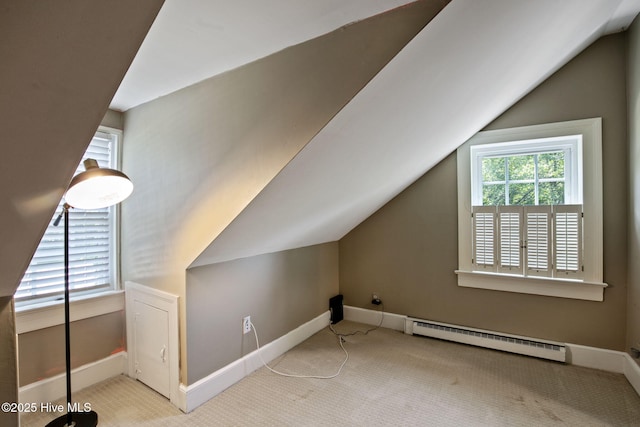 1305 Kenan St NW, Wilson, NC 27893 - additional living space with a baseboard radiator, baseboards, carpet floors, and lofted ceiling