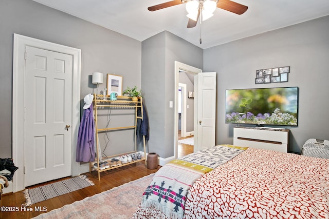 1305 Kenan St NW, Wilson, NC 27893 - bedroom featuring wood finished floors, ceiling fan, and baseboards