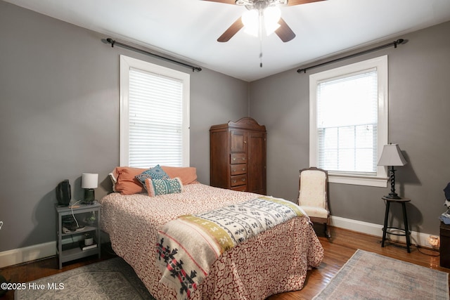 1305 Kenan St NW, Wilson, NC 27893 - bedroom with baseboards, wood finished floors, and a ceiling fan