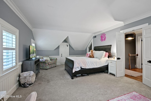 1305 Kenan St NW, Wilson, NC 27893 - carpeted bedroom featuring ornamental molding, multiple windows, and wainscoting