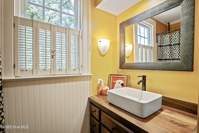 1305 Kenan St NW, Wilson, NC 27893 - bathroom featuring vanity and ornamental molding