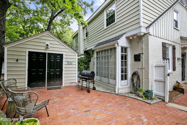 1305 Kenan St NW, Wilson, NC 27893 - view of patio with area for grilling and an outbuilding