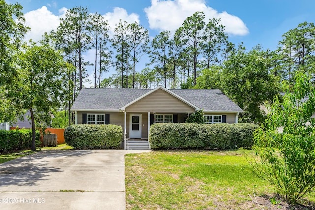 1711 Reidsville Rd, Southport, NC 28461 - view of front of property with a porch, driveway, and roof with shingles