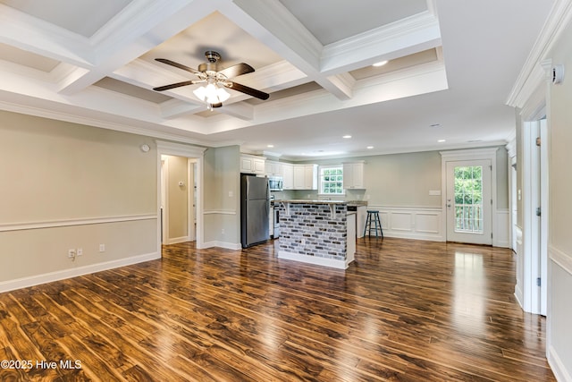 1711 Reidsville Rd, Southport, NC 28461 - unfurnished living room featuring crown molding, dark wood finished floors, a ceiling fan, beam ceiling, and coffered ceiling
