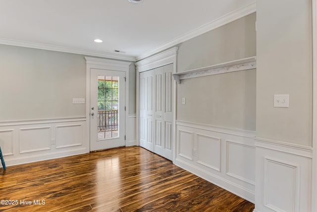 1711 Reidsville Rd, Southport, NC 28461 - foyer featuring crown molding, wainscoting, a decorative wall, recessed lighting, and wood finished floors