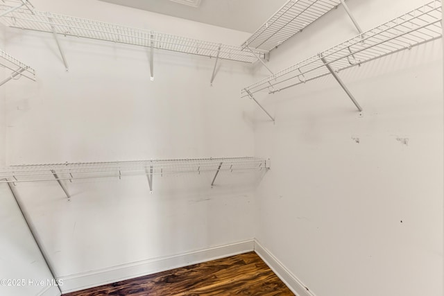 1711 Reidsville Rd, Southport, NC 28461 - spacious closet featuring dark wood-type flooring