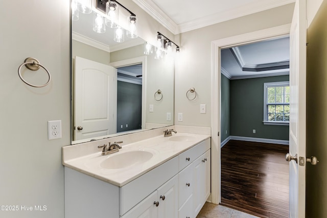 1711 Reidsville Rd, Southport, NC 28461 - full bathroom with double vanity, ornamental molding, baseboards, and wood finished floors