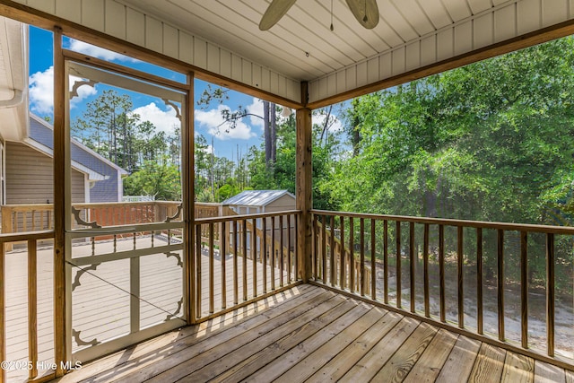 1711 Reidsville Rd, Southport, NC 28461 - deck with ceiling fan and view of scattered trees