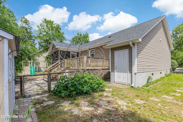 1711 Reidsville Rd, Southport, NC 28461 - back of house with a deck, a shingled roof, and a gate