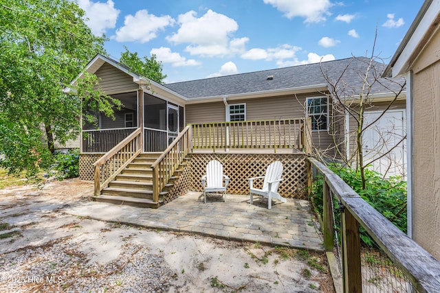 1711 Reidsville Rd, Southport, NC 28461 - rear view of house with a sunroom, a patio area, roof with shingles, and stairs