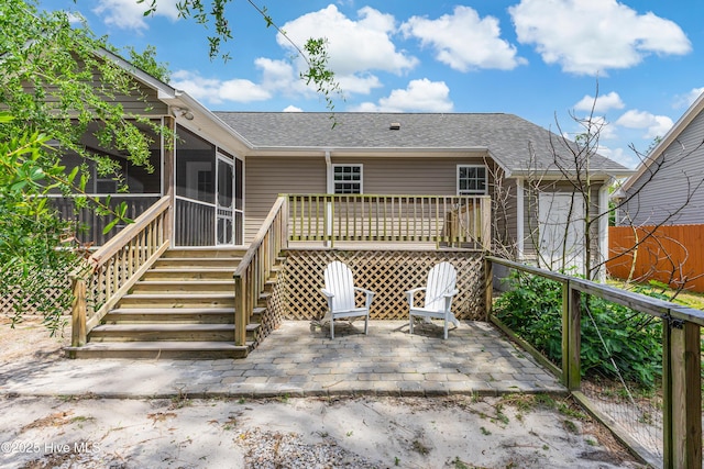 1711 Reidsville Rd, Southport, NC 28461 - back of property featuring a sunroom, a patio, a shingled roof, and stairs