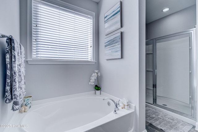 576 Steele Loop, Wilmington, NC 28411 - full bathroom featuring a garden tub and a shower stall