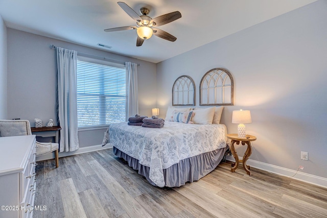 576 Steele Loop, Wilmington, NC 28411 - bedroom featuring baseboards, light wood-style flooring, and ceiling fan
