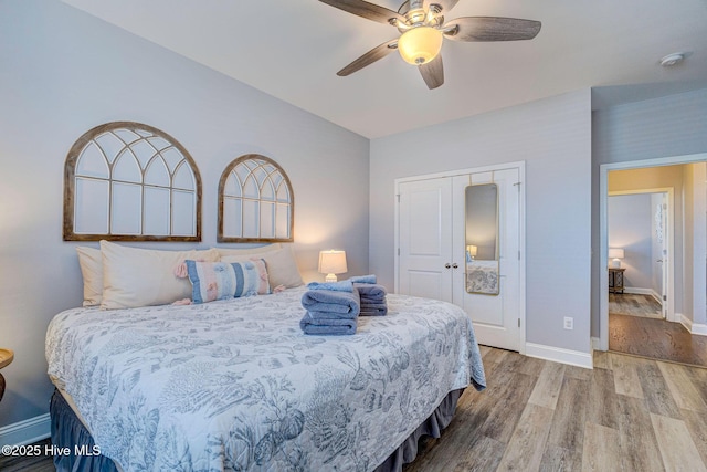 576 Steele Loop, Wilmington, NC 28411 - bedroom with wood finished floors, baseboards, a closet, and a ceiling fan