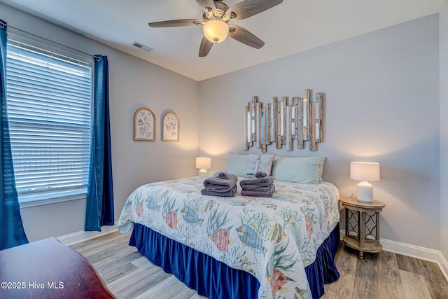 576 Steele Loop, Wilmington, NC 28411 - bedroom with wood finished floors, baseboards, and a ceiling fan