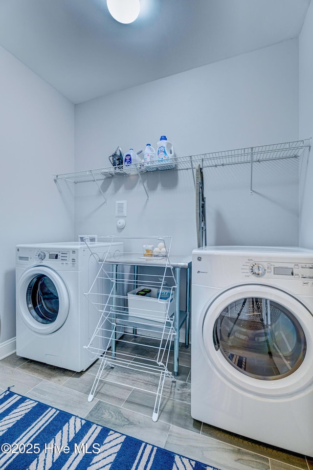 576 Steele Loop, Wilmington, NC 28411 - laundry area featuring washer and dryer and baseboards