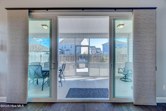 576 Steele Loop, Wilmington, NC 28411 - doorway with wood finished floors and baseboards