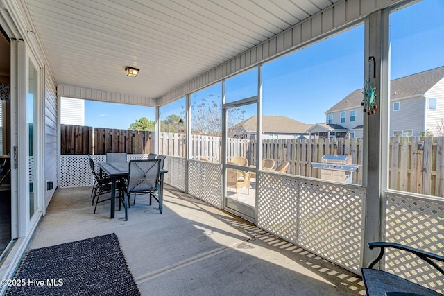 576 Steele Loop, Wilmington, NC 28411 - sunroom / solarium featuring outdoor dining space, healthy amount of natural light, and a residential view
