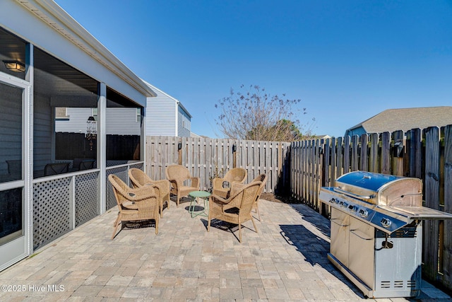576 Steele Loop, Wilmington, NC 28411 - fenced backyard featuring a patio area, area for grilling, and outdoor lounge area