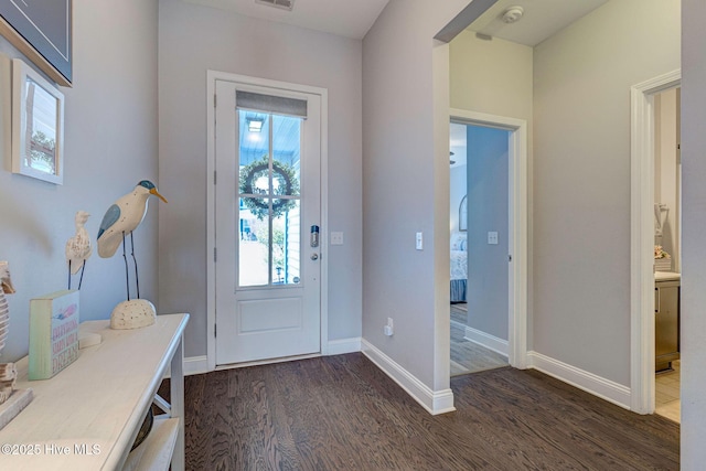 576 Steele Loop, Wilmington, NC 28411 - foyer featuring dark wood-type flooring and baseboards