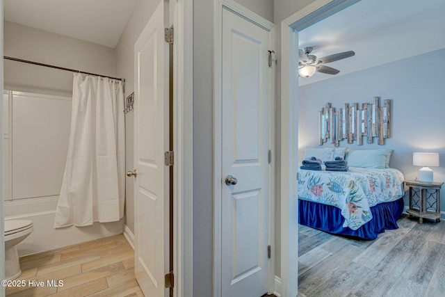 576 Steele Loop, Wilmington, NC 28411 - full bath featuring ensuite bathroom, wood finished floors, shower / bathtub combination with curtain, ceiling fan, and toilet