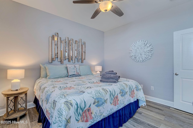 576 Steele Loop, Wilmington, NC 28411 - bedroom featuring baseboards, wood finished floors, and ceiling fan