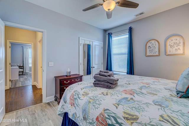 576 Steele Loop, Wilmington, NC 28411 - bedroom with wood finished floors, a closet, ceiling fan, and baseboards