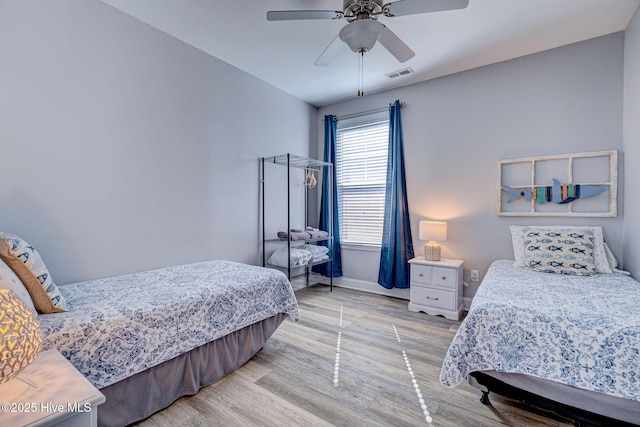 576 Steele Loop, Wilmington, NC 28411 - bedroom featuring light wood finished floors, baseboards, and a ceiling fan