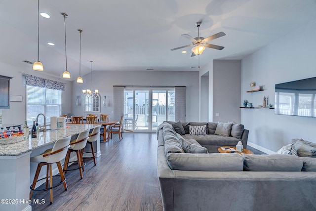 576 Steele Loop, Wilmington, NC 28411 - living room with dark wood-style floors, ceiling fan, a chandelier, and recessed lighting