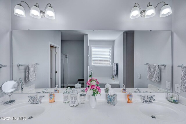576 Steele Loop, Wilmington, NC 28411 - full bathroom with a bath, double vanity, and a shower stall