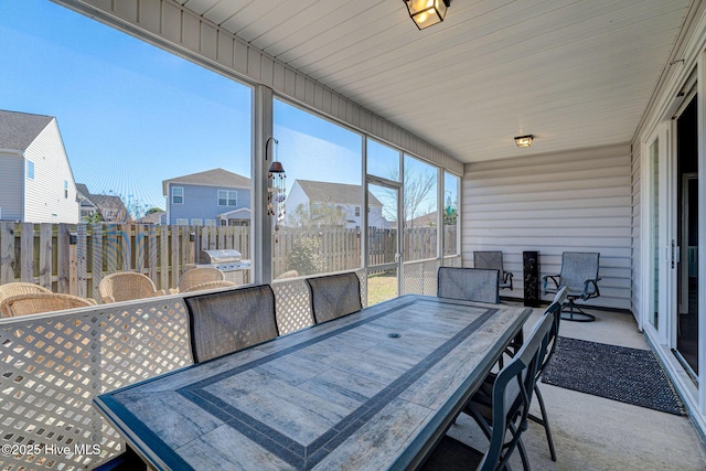 576 Steele Loop, Wilmington, NC 28411 - sunroom featuring outdoor dining area and a residential view