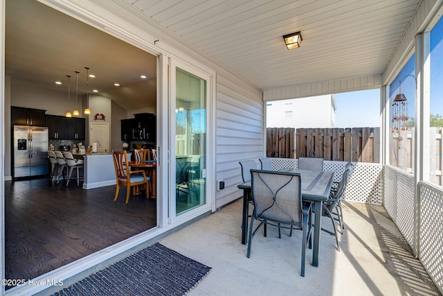 576 Steele Loop, Wilmington, NC 28411 - sunroom featuring outdoor dining space, plenty of natural light, and a sink
