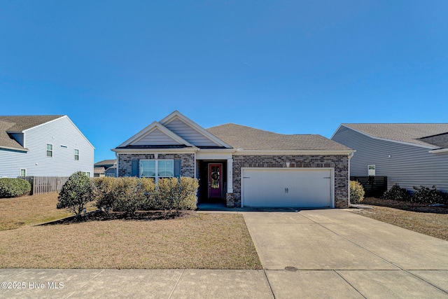576 Steele Loop, Wilmington, NC 28411 - ranch-style house with an attached garage, concrete driveway, and brick siding