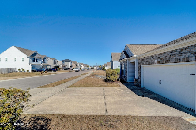 576 Steele Loop, Wilmington, NC 28411 - view of asphalt street featuring a residential view