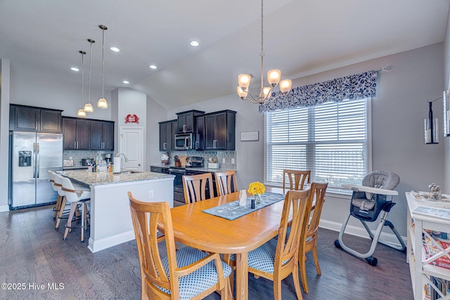 576 Steele Loop, Wilmington, NC 28411 - dining room with dark wood-style flooring, vaulted ceiling, a chandelier, recessed lighting, and baseboards