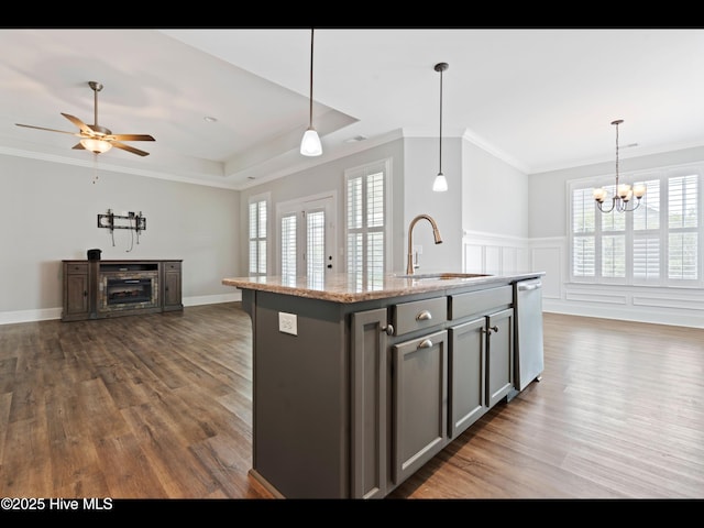 7024 Bonaventure St SW, Ocean Isle Beach, NC 28469 - kitchen with dishwasher, a sink, ornamental molding, wood finished floors, and gray cabinetry