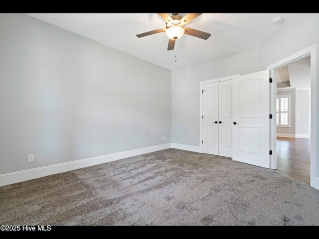 7024 Bonaventure St SW, Ocean Isle Beach, NC 28469 - unfurnished bedroom with carpet, baseboards, a closet, and a ceiling fan
