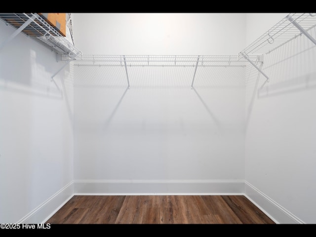 7024 Bonaventure St SW, Ocean Isle Beach, NC 28469 - spacious closet featuring dark wood finished floors