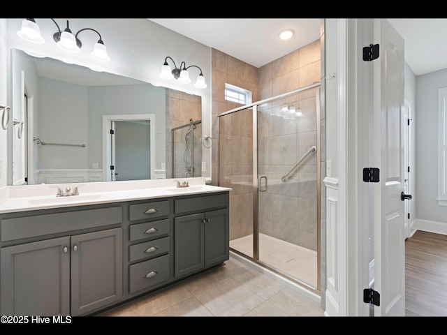7024 Bonaventure St SW, Ocean Isle Beach, NC 28469 - full bath with a stall shower, double vanity, and tile patterned flooring