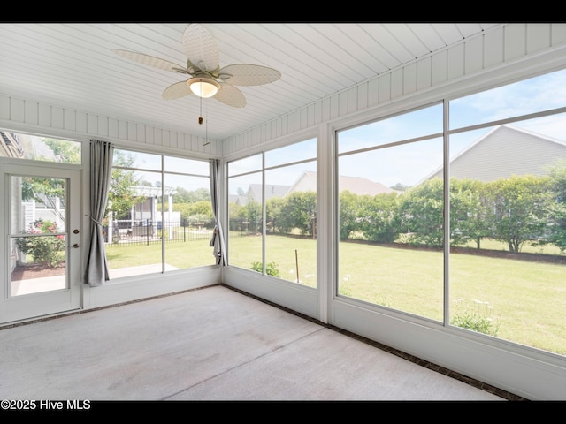7024 Bonaventure St SW, Ocean Isle Beach, NC 28469 - unfurnished sunroom featuring a ceiling fan and plenty of natural light